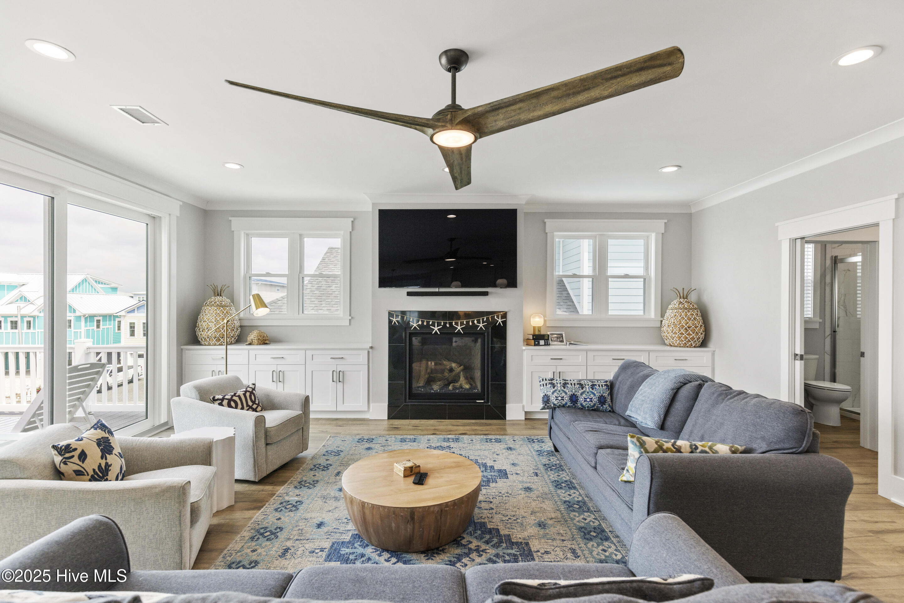 403 17th Street Sunset Beach, NC 28468 - Photo 15 of 58 Fireplace and built in cabinetry