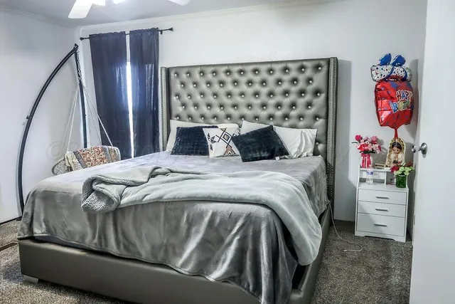 a bedroom with a bed and dresser