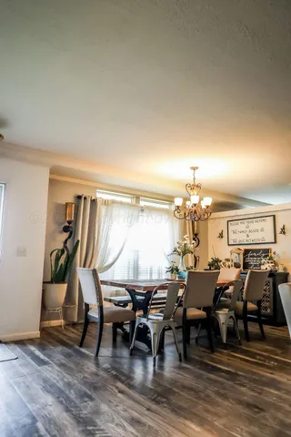 a view of a dining area with furniture and wooden floor