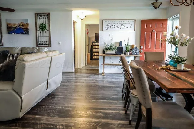 a dining room with furniture and window