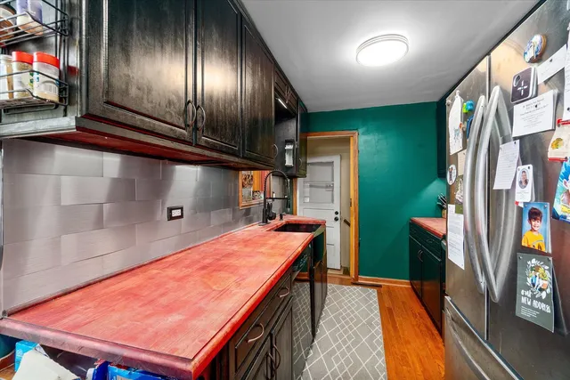 a kitchen with stainless steel appliances granite countertop a stove and a microwave