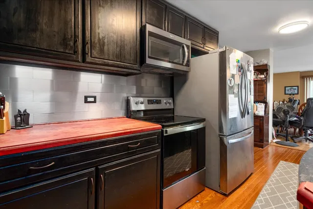 a reading room with furniture and a book shelf