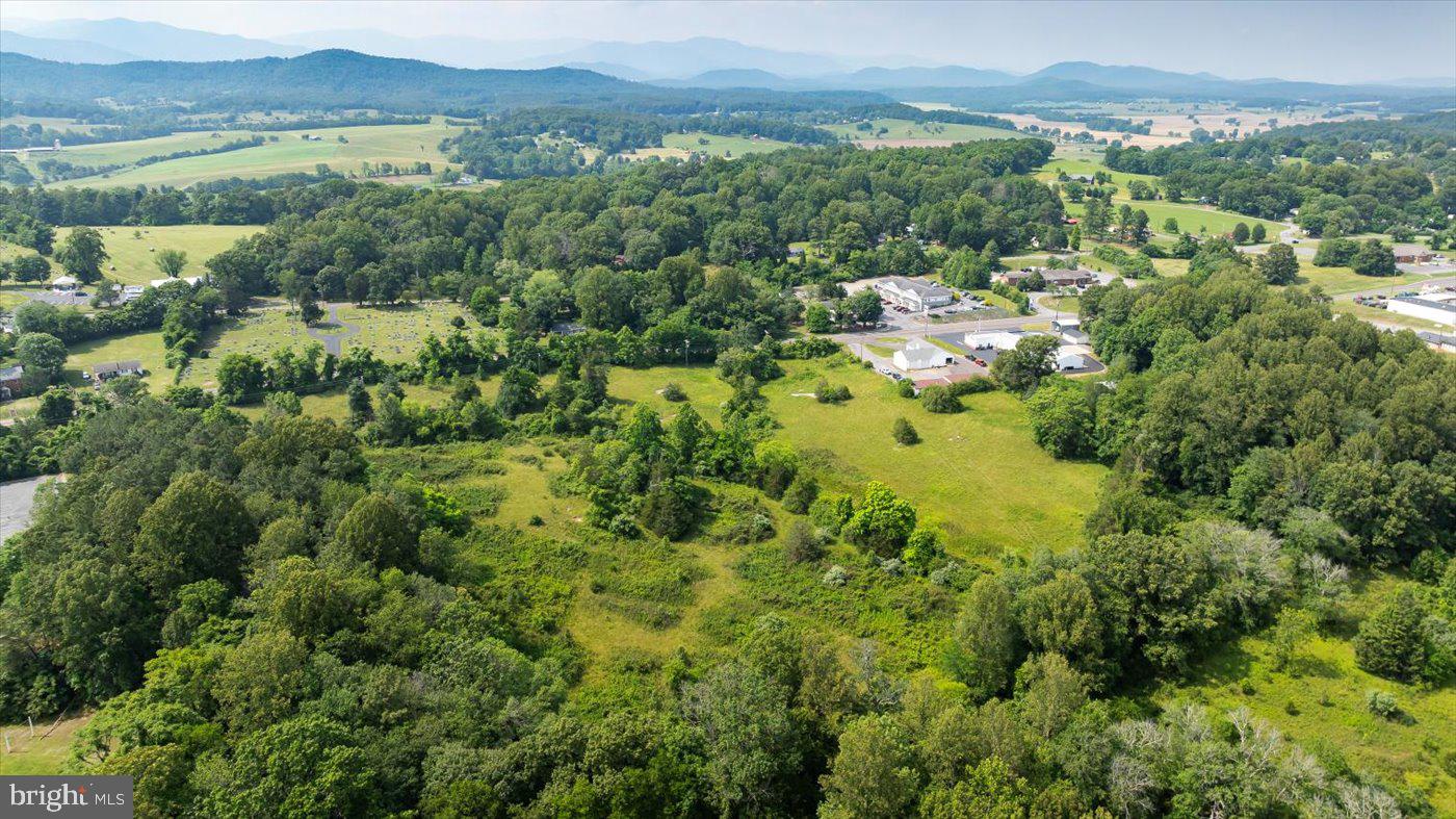 North Main Street Madison, VA 22727 - Photo 6 of 14 an aerial view of a houses with a lush green hillside