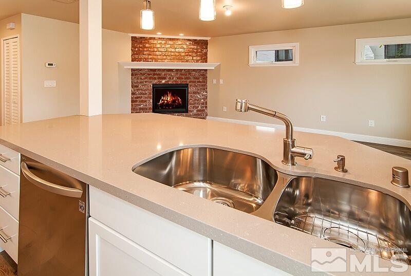 74 Caliente Street Reno, NV 89509 - Photo 7 of 13 a kitchen with a sink and a stove top oven