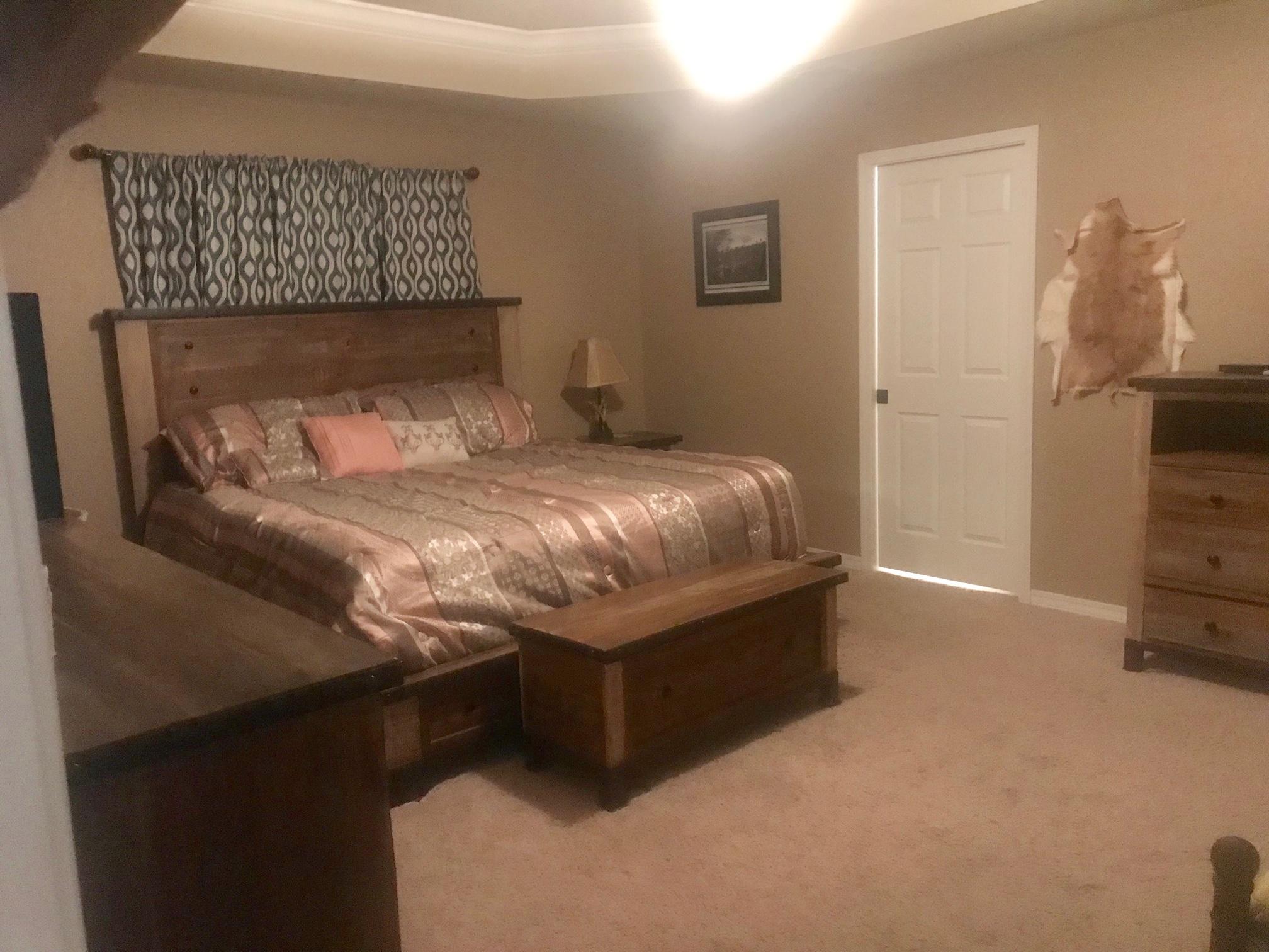 918 Deshazo Road Crestview, FL 32539 - Photo 23 of 28 a bed sitting in a bedroom next to a window