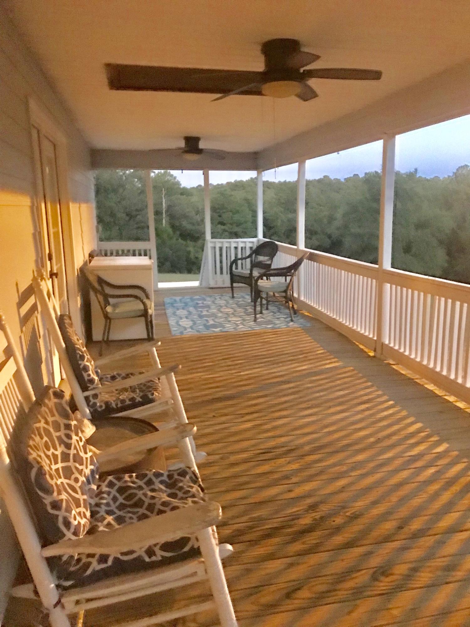 918 Deshazo Road Crestview, FL 32539 - Photo 26 of 28 a view of a patio with a table chairs and backyard