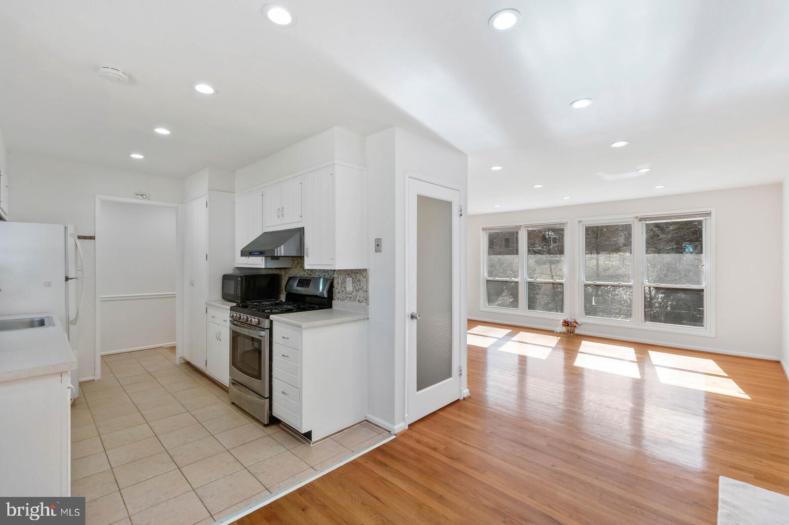 4423 Roundhill Road Alexandria, VA 22310 - Photo 12 of 41 Dining area opens to large bright living room