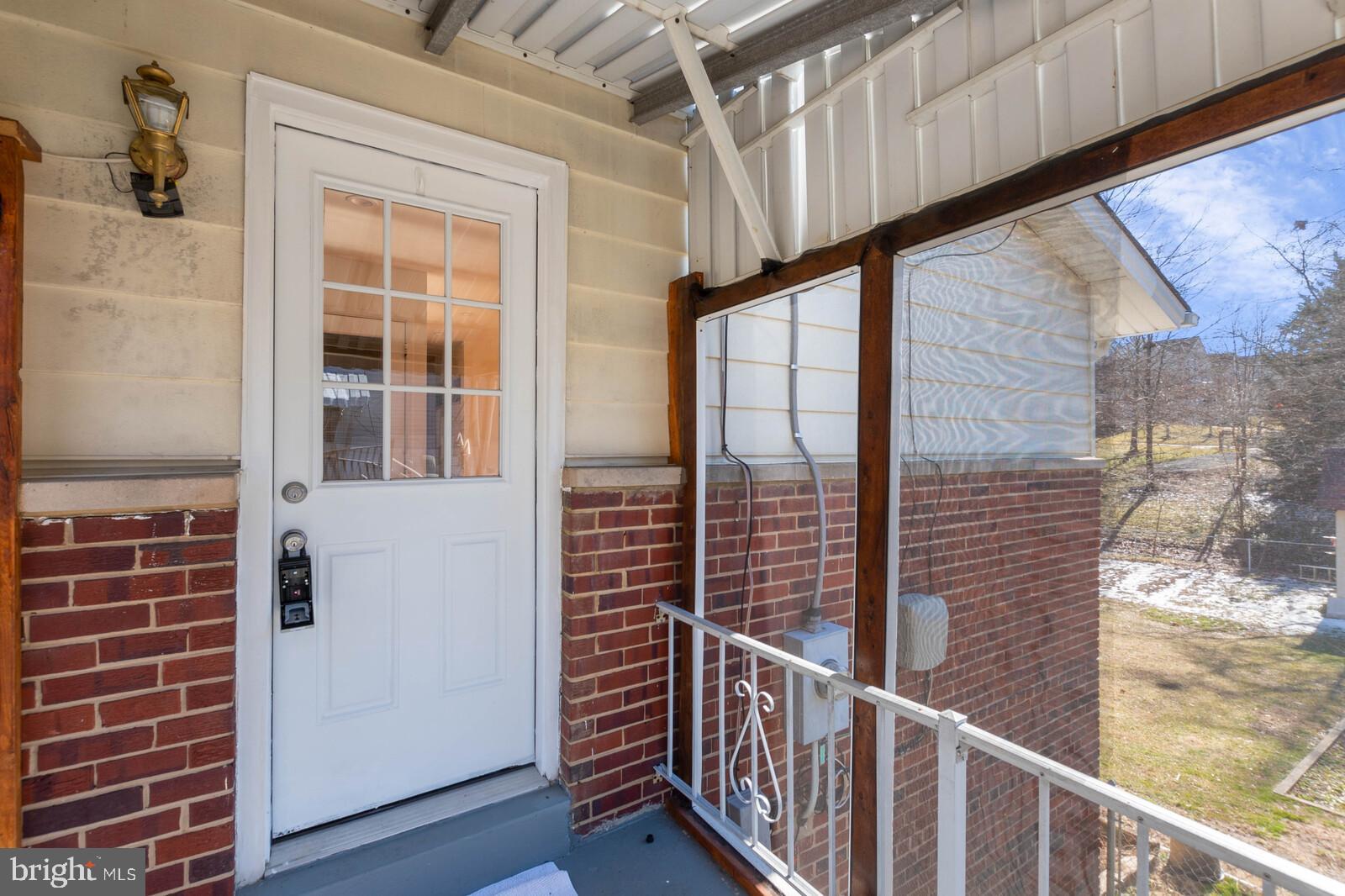 4423 Roundhill Road Alexandria, VA 22310 - Photo 4 of 41 Side door entrance with small screened porch
