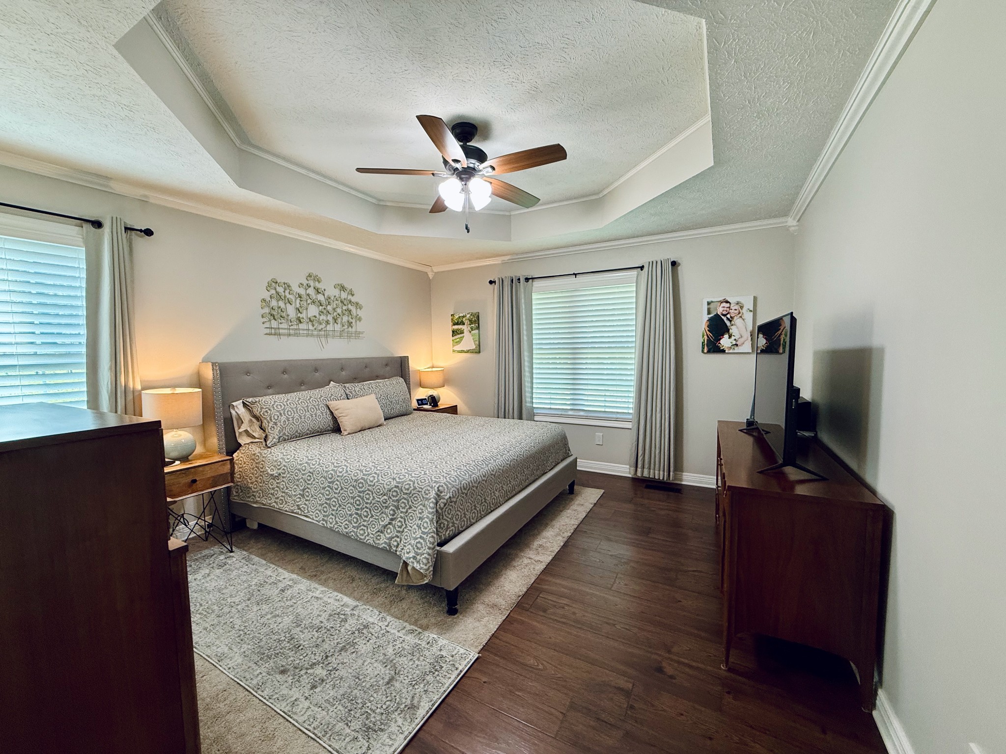 320 Spring Valley Drive Cottontown, TN 37048 - Photo 11 of 48 a bedroom with a bed and a chandelier