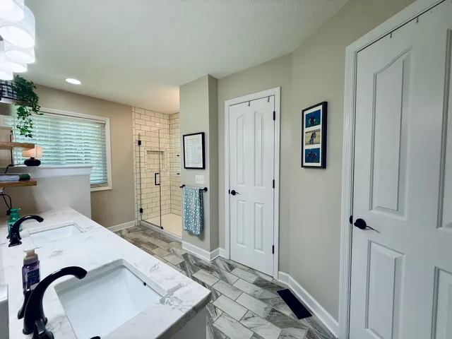 a bathroom with a sink and mirror