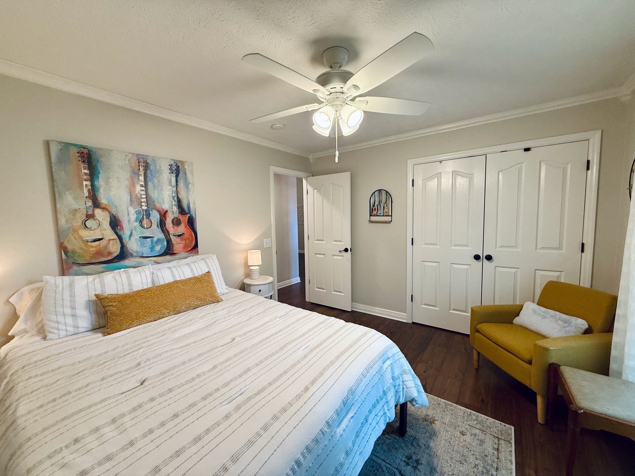 320 Spring Valley Drive Cottontown, TN 37048 - Photo 17 of 48 a bedroom with a bed and a chandelier