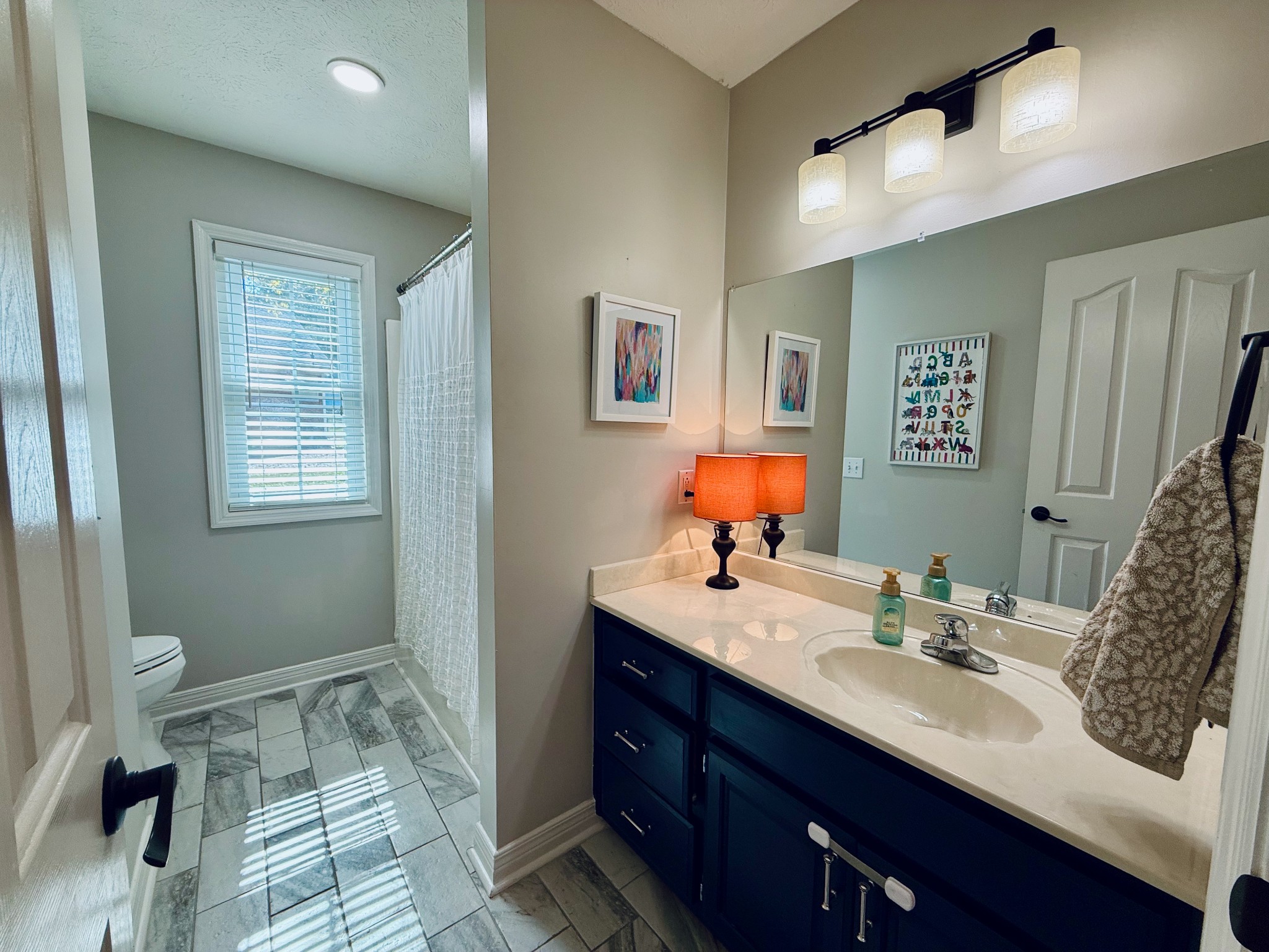 320 Spring Valley Drive Cottontown, TN 37048 - Photo 18 of 48 a bathroom with a sink double vanity and a toilet