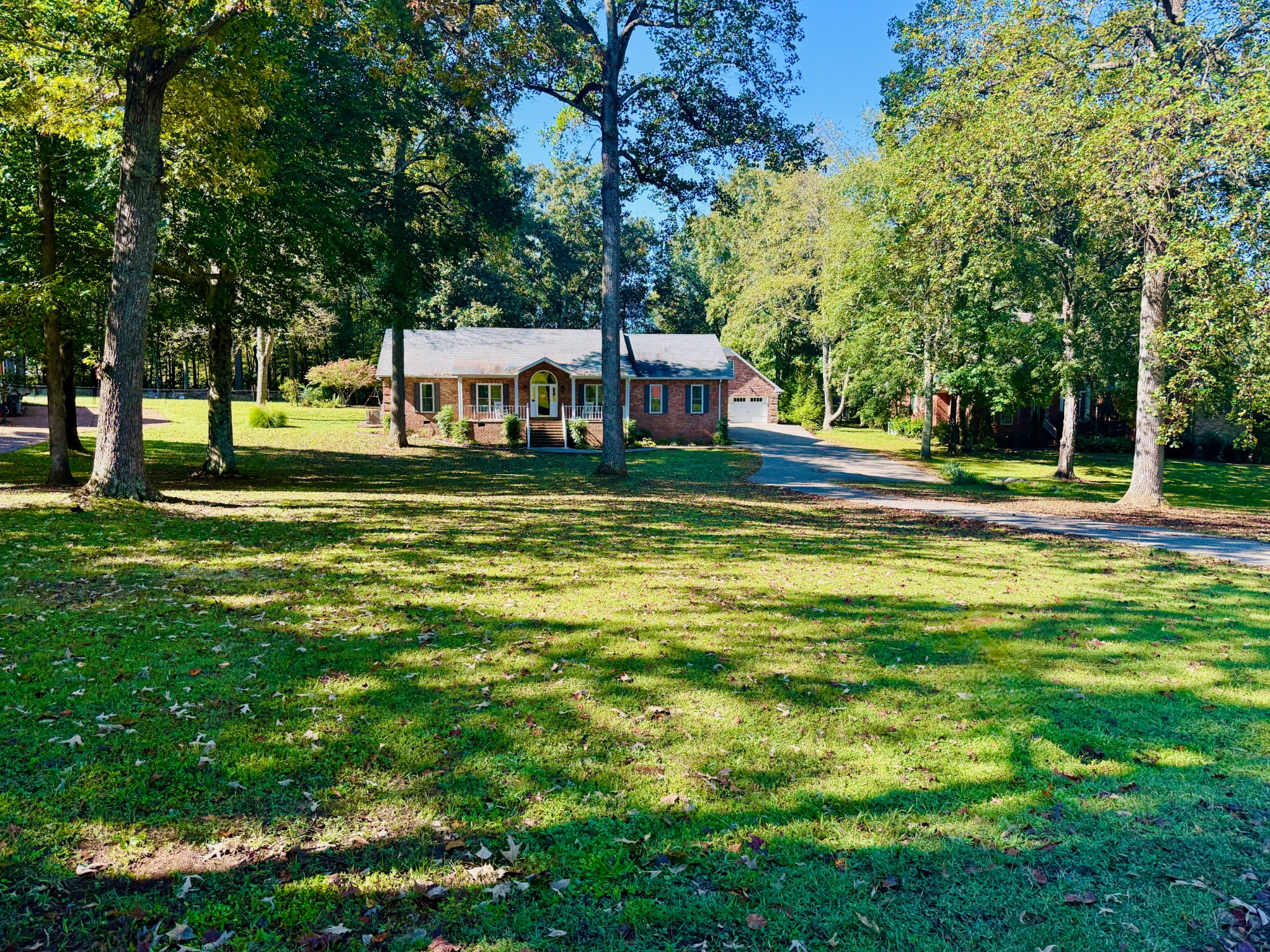 320 Spring Valley Drive Cottontown, TN 37048 - Photo 2 of 48 a house view with a big yard and large trees