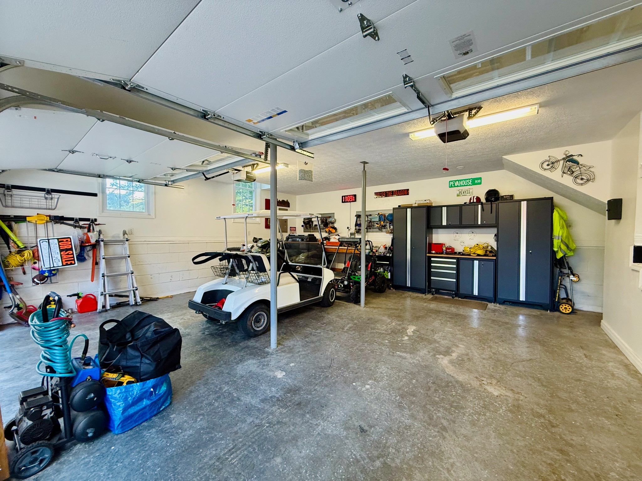 320 Spring Valley Drive Cottontown, TN 37048 - Photo 28 of 48 a view of a garage with a lot of stuff and toys