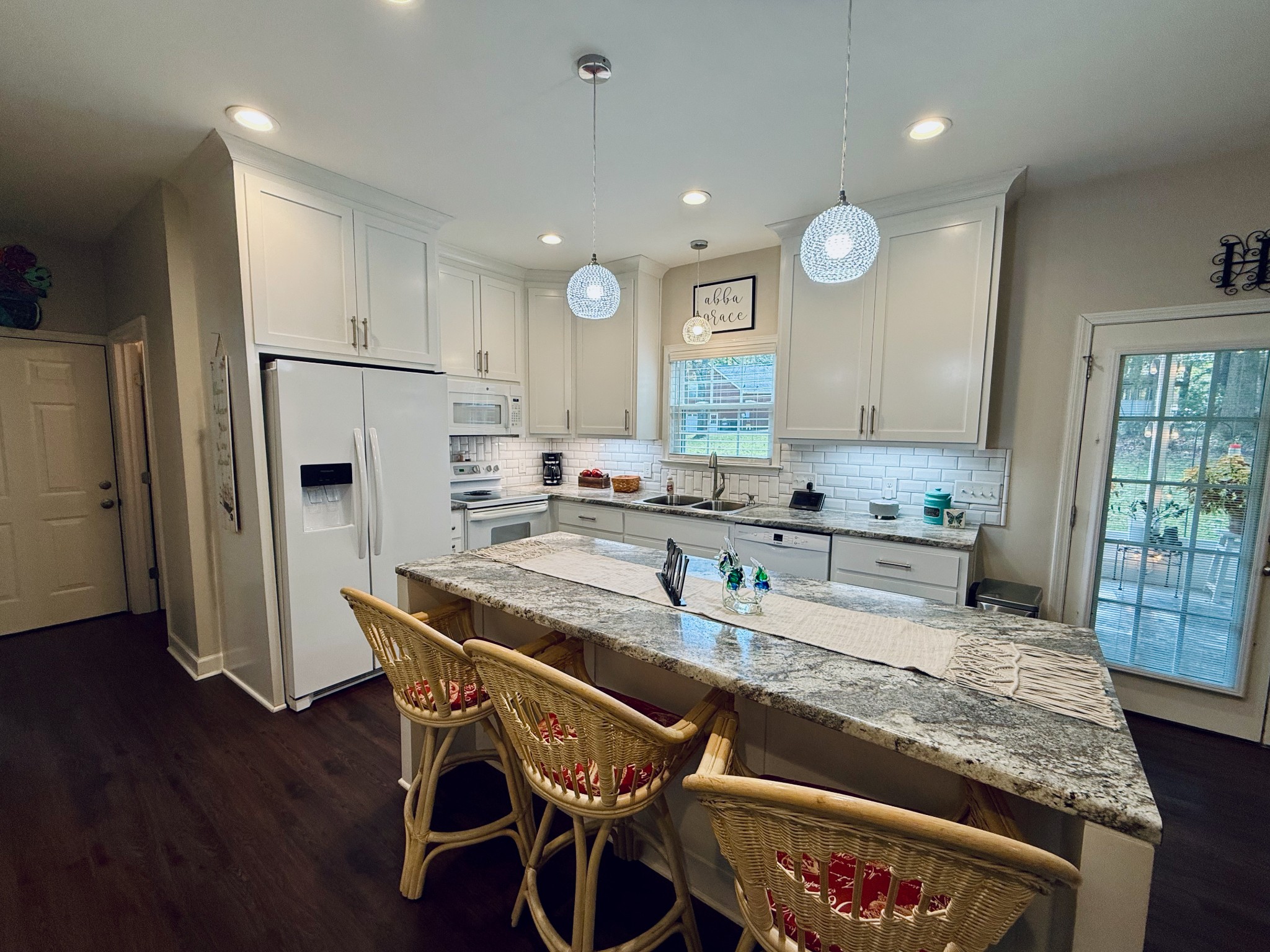 320 Spring Valley Drive Cottontown, TN 37048 - Photo 33 of 48 a kitchen with stainless steel appliances granite countertop a stove refrigerator sink and cabinets