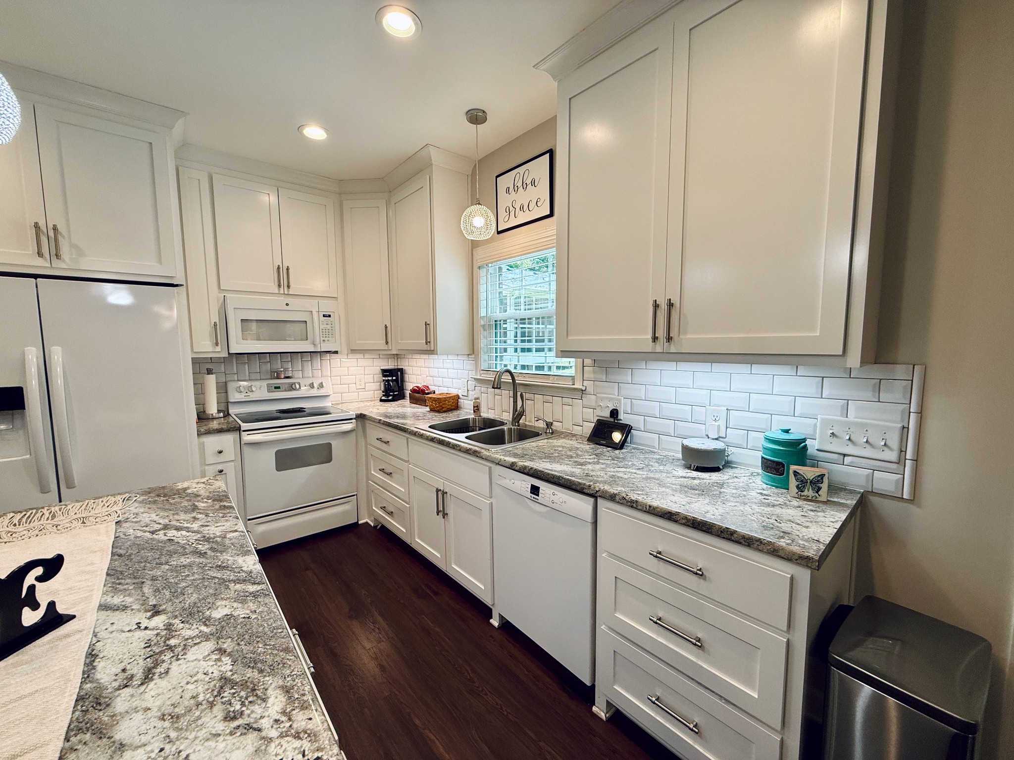 320 Spring Valley Drive Cottontown, TN 37048 - Photo 34 of 48 a kitchen with granite countertop a sink stainless steel appliances and cabinets