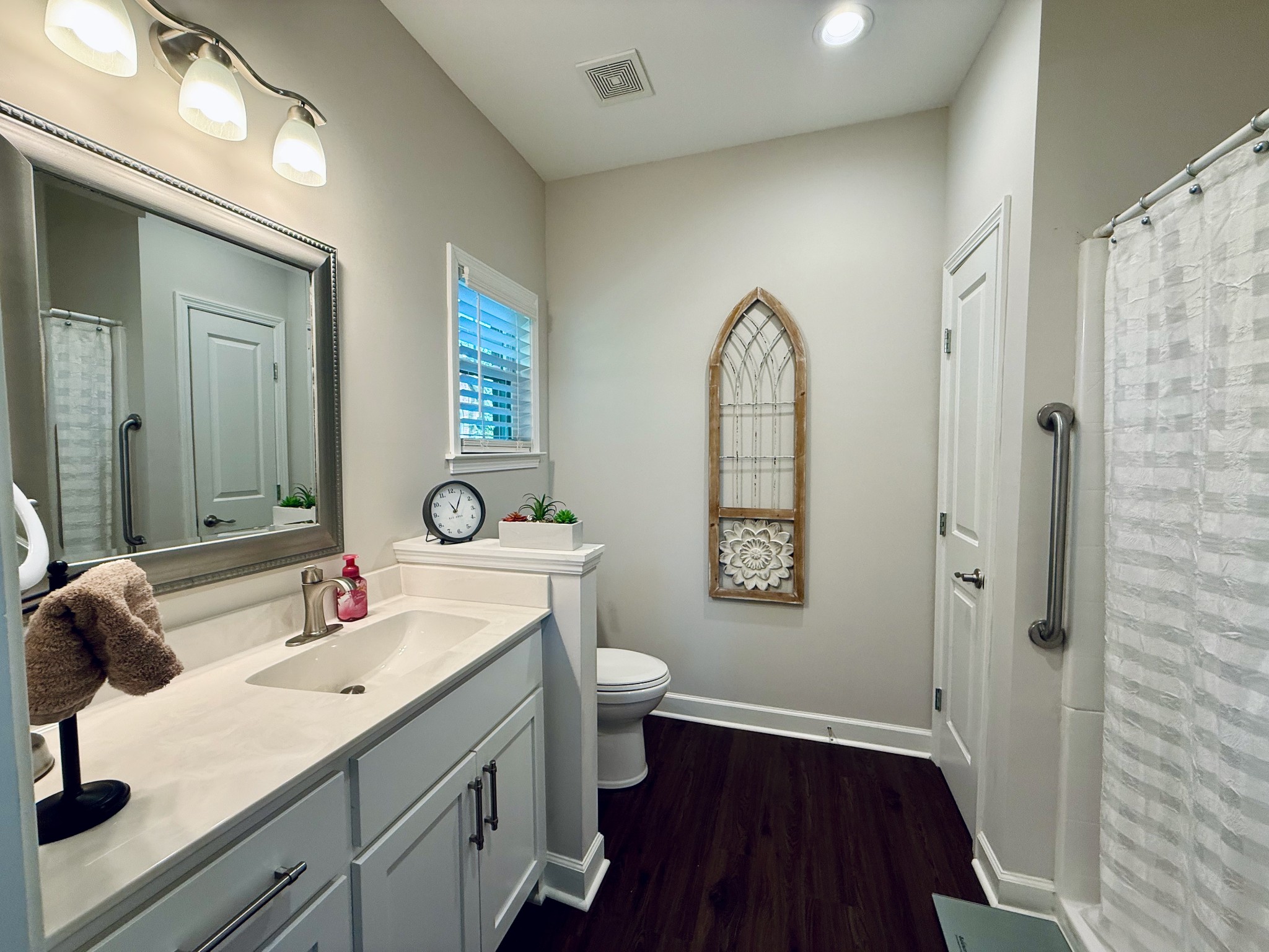 320 Spring Valley Drive Cottontown, TN 37048 - Photo 37 of 48 a bathroom with a double vanity sink and a mirror