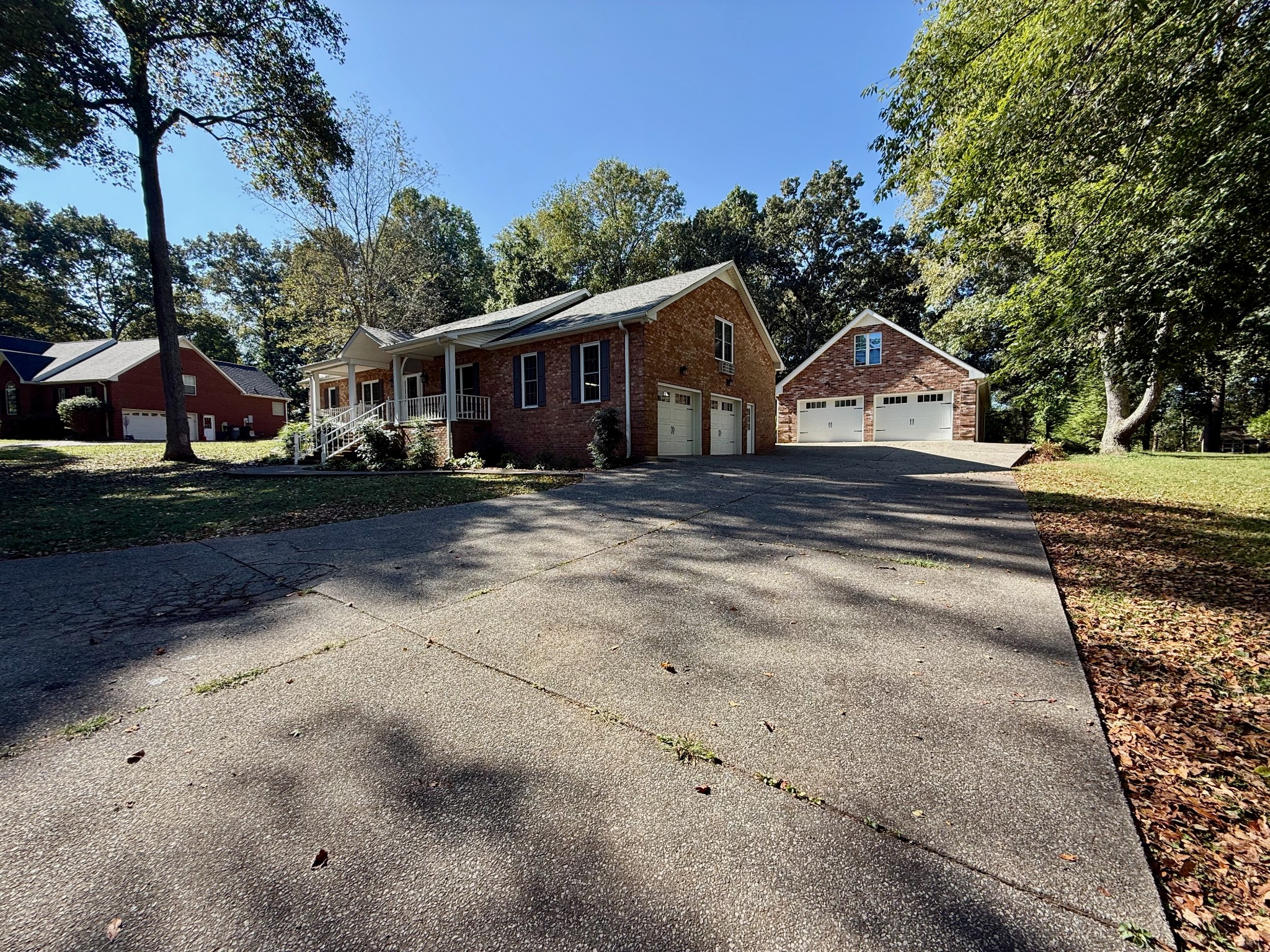 320 Spring Valley Drive Cottontown, TN 37048 - Photo 46 of 48 a view of a big house with a big yard and large trees