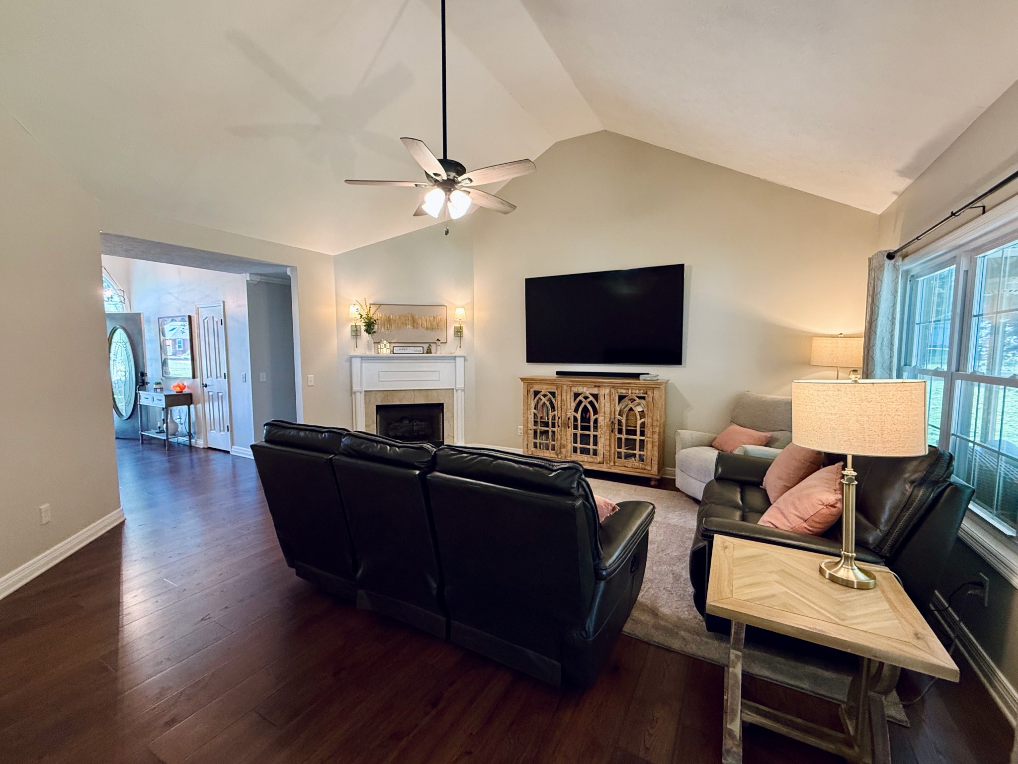 320 Spring Valley Drive Cottontown, TN 37048 - Photo 7 of 48 a living room with furniture a fireplace and a flat screen tv