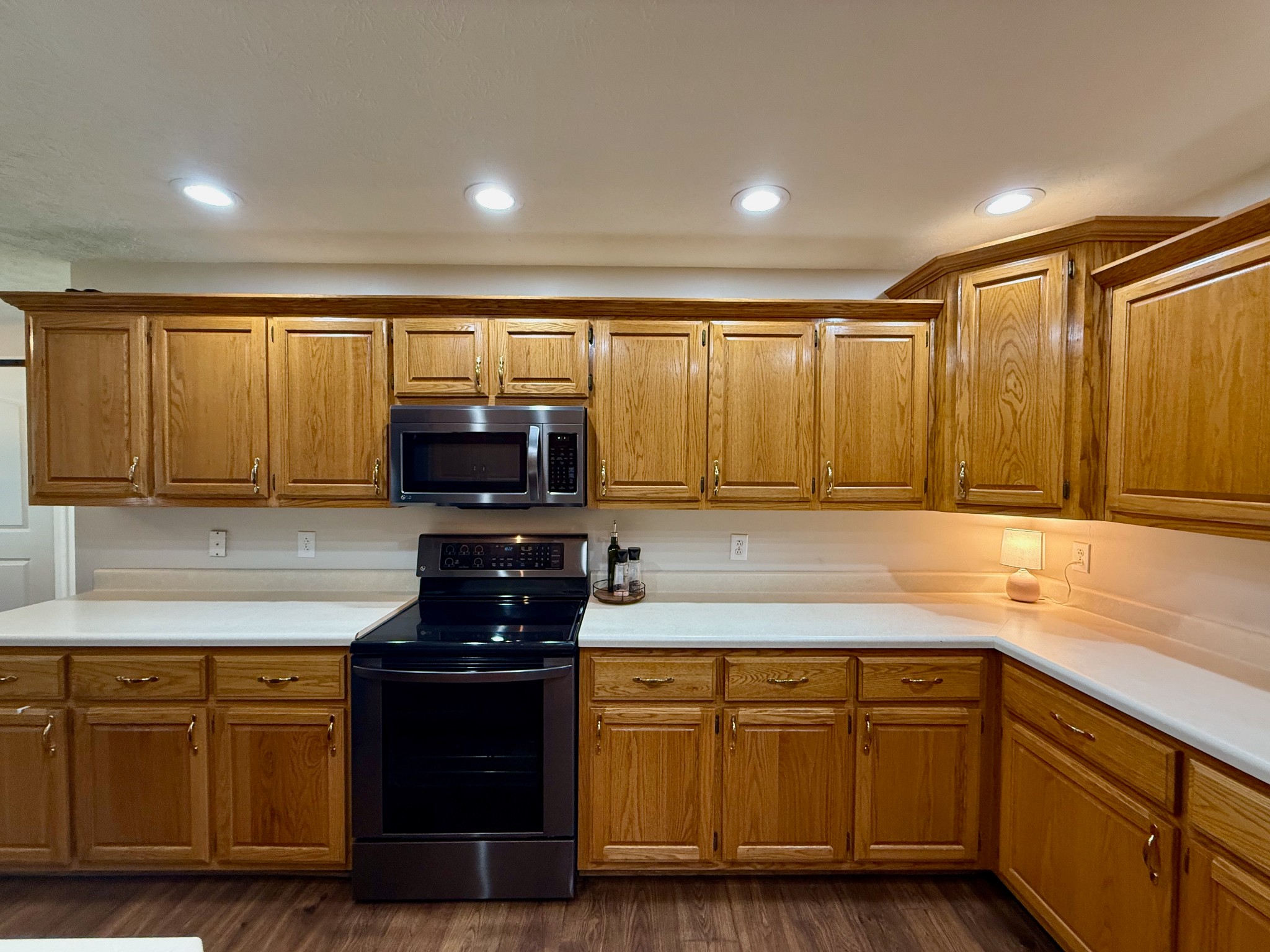 320 Spring Valley Drive Cottontown, TN 37048 - Photo 10 of 48 a kitchen with granite countertop a sink and a stove top oven