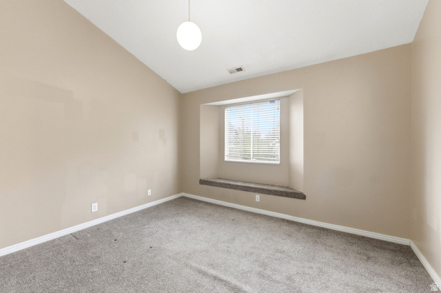 1052 South 950 East, Unit 33 Provo, UT 84606 - Photo 7 of 12 Empty room featuring lofted ceiling and light carpet