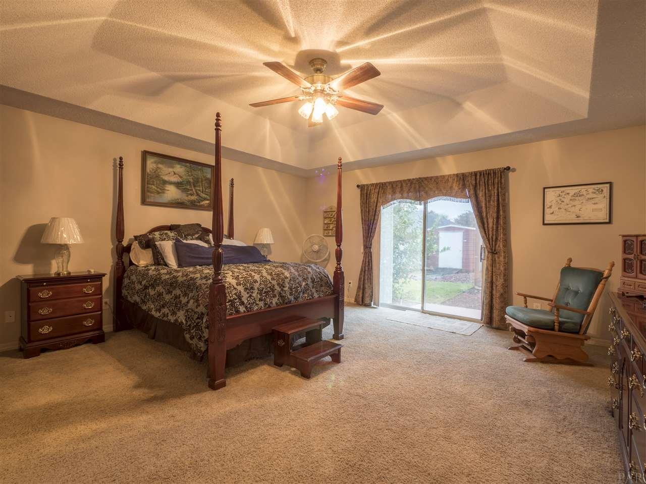 3977 High Bridge Drive Pace, FL 32571 - Photo 14 of 35 Large bedroom with sliders to backyard