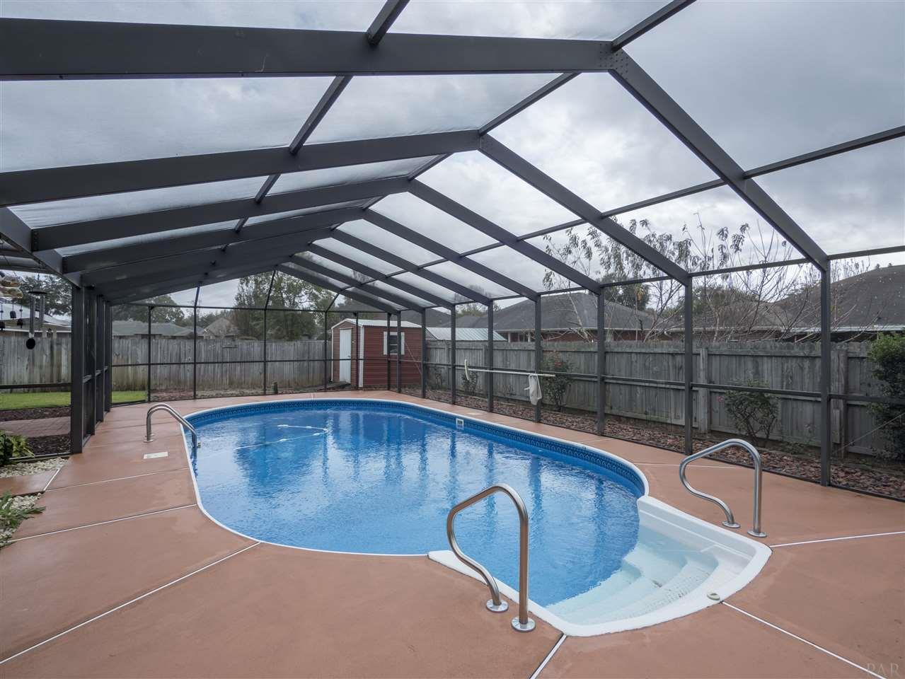 3977 High Bridge Drive Pace, FL 32571 - Photo 32 of 35 Pool enclosure with pool decking