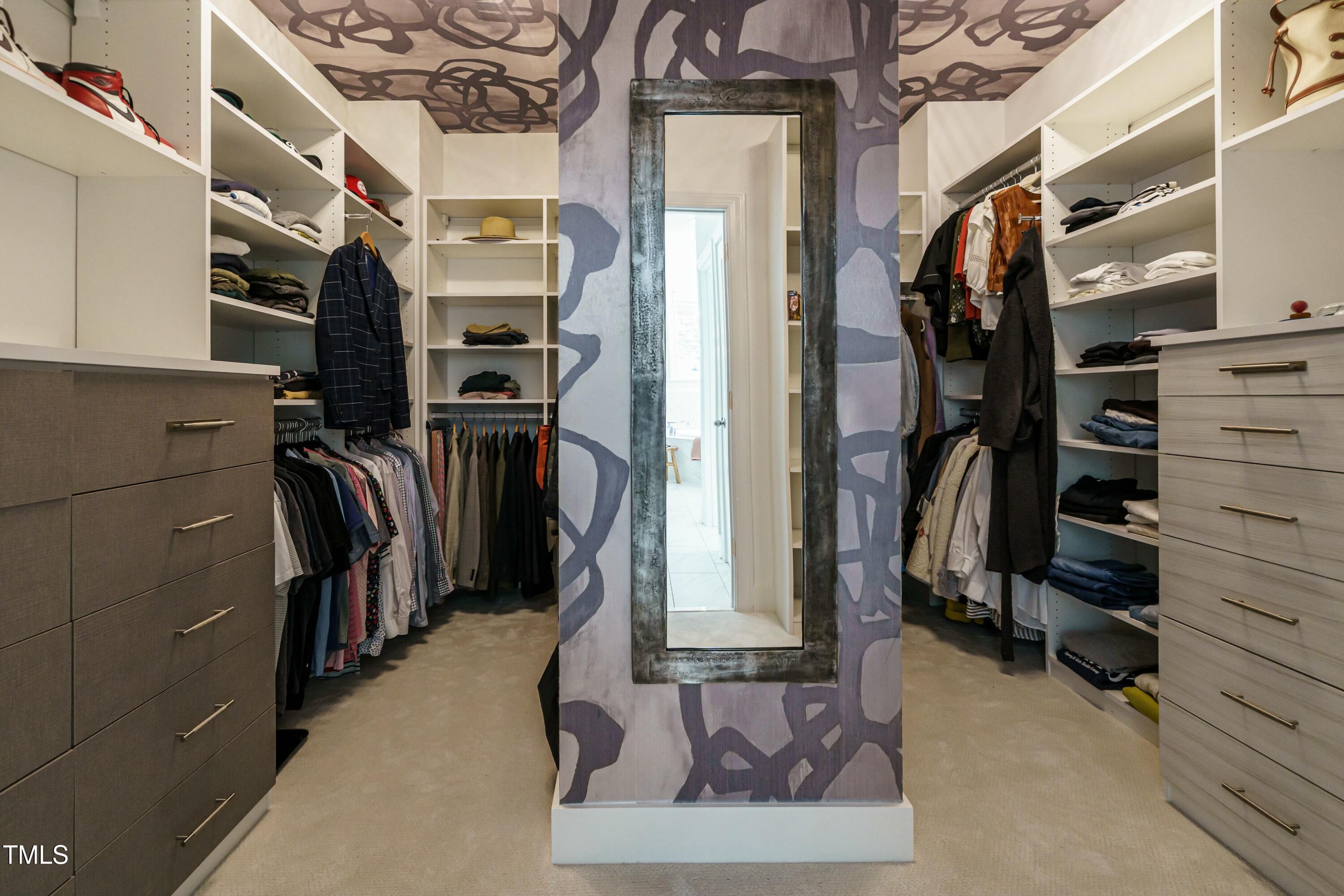 5265 Aleppo Lane Raleigh, NC 27613 - Photo 28 of 45 a view of walk in closet with clothes and shoes