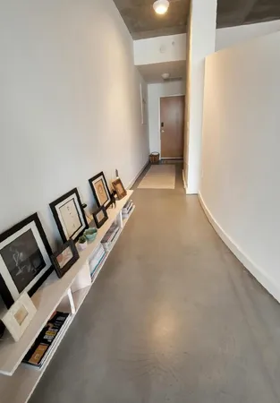 a front view of a building with lake view and a large building