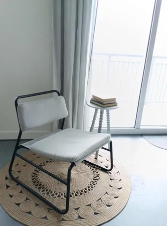 a front view of a house with a garden and swimming pool