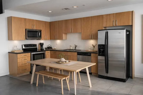 a bedroom with a bed and cabinets