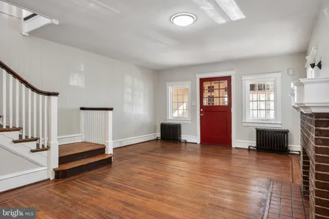 a view of livingroom with hardwood floor and a ceiling fan