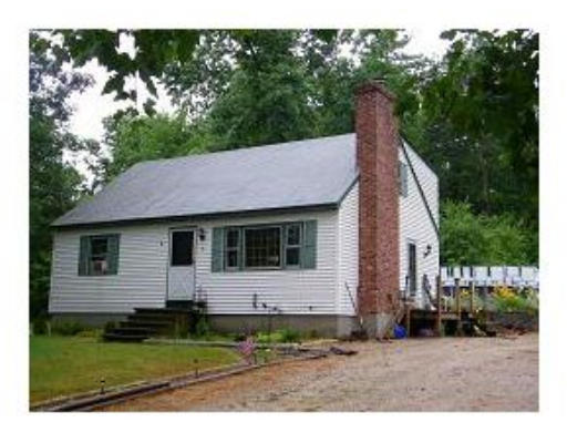 a aerial view of a house with a yard