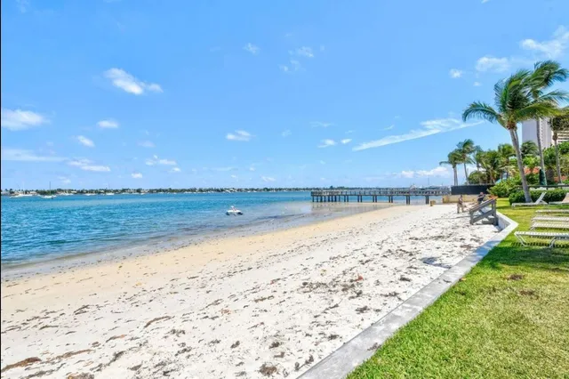 a view of an ocean beach and a yard