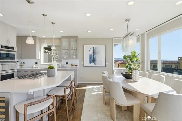 a kitchen with stainless steel appliances kitchen island granite countertop a sink and cabinets
