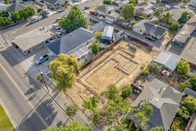 a aerial view of multi story residential apartment building