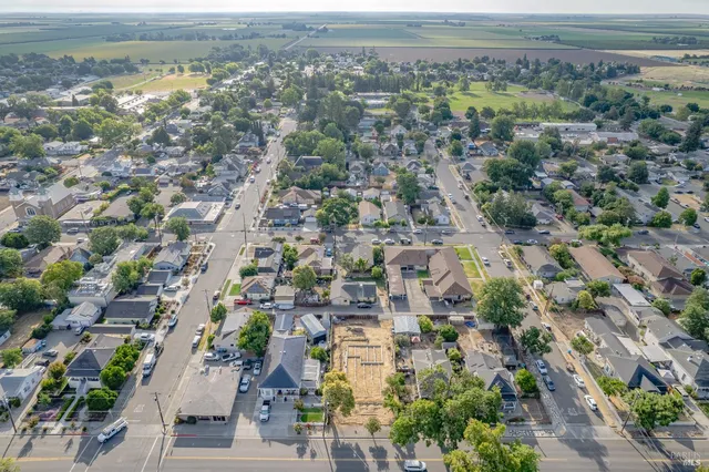 an aerial view of residential houses with outdoor space