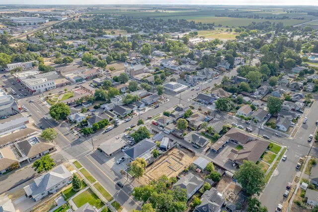 an aerial view of a city with ocean view