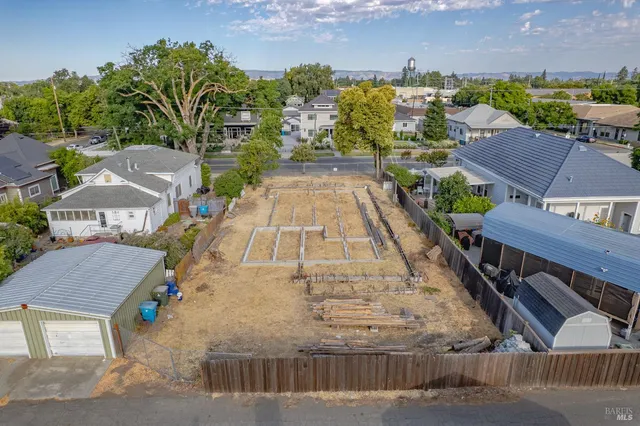 an aerial view of a house with a swimming pool