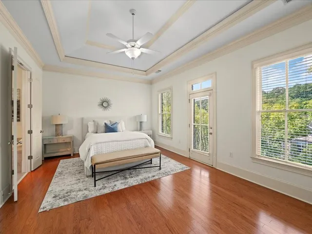 a living room with furniture and a mirror