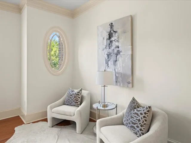 a spacious bedroom with a bed a table and a window