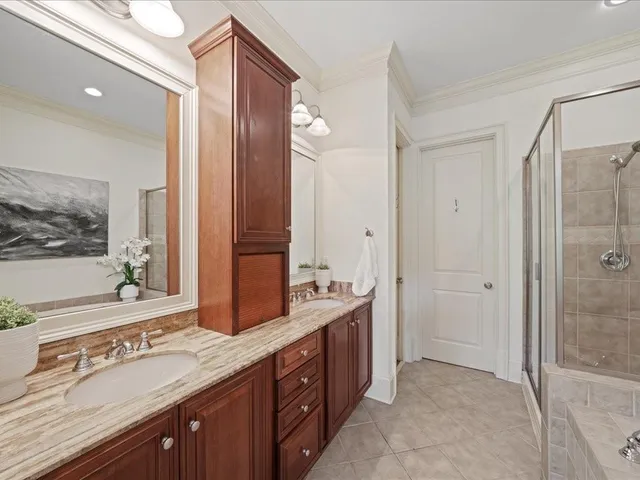 a bathroom with a bathtub and a shower