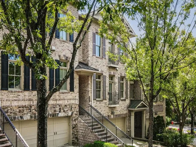 front view of a house with a tree