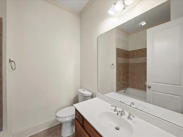 a living room with furniture a wooden floor and a window