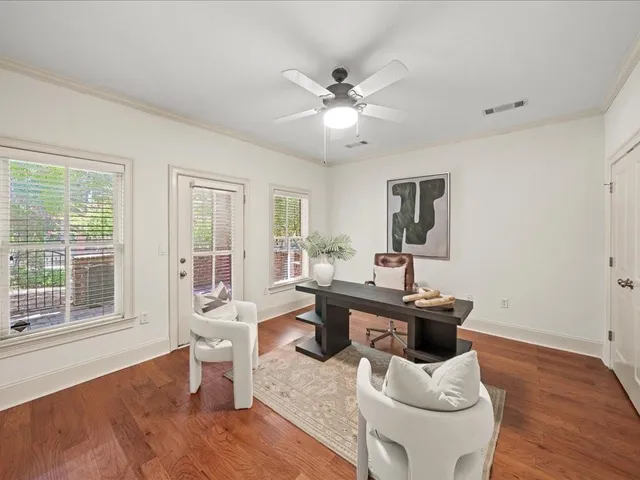 a bathroom with a bathtub shower sink mirror vanity and toilet
