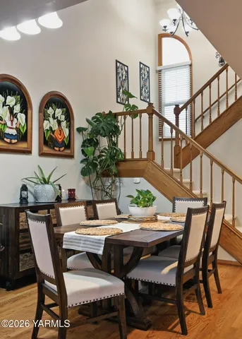 a view of a dining room with furniture and a potted plant