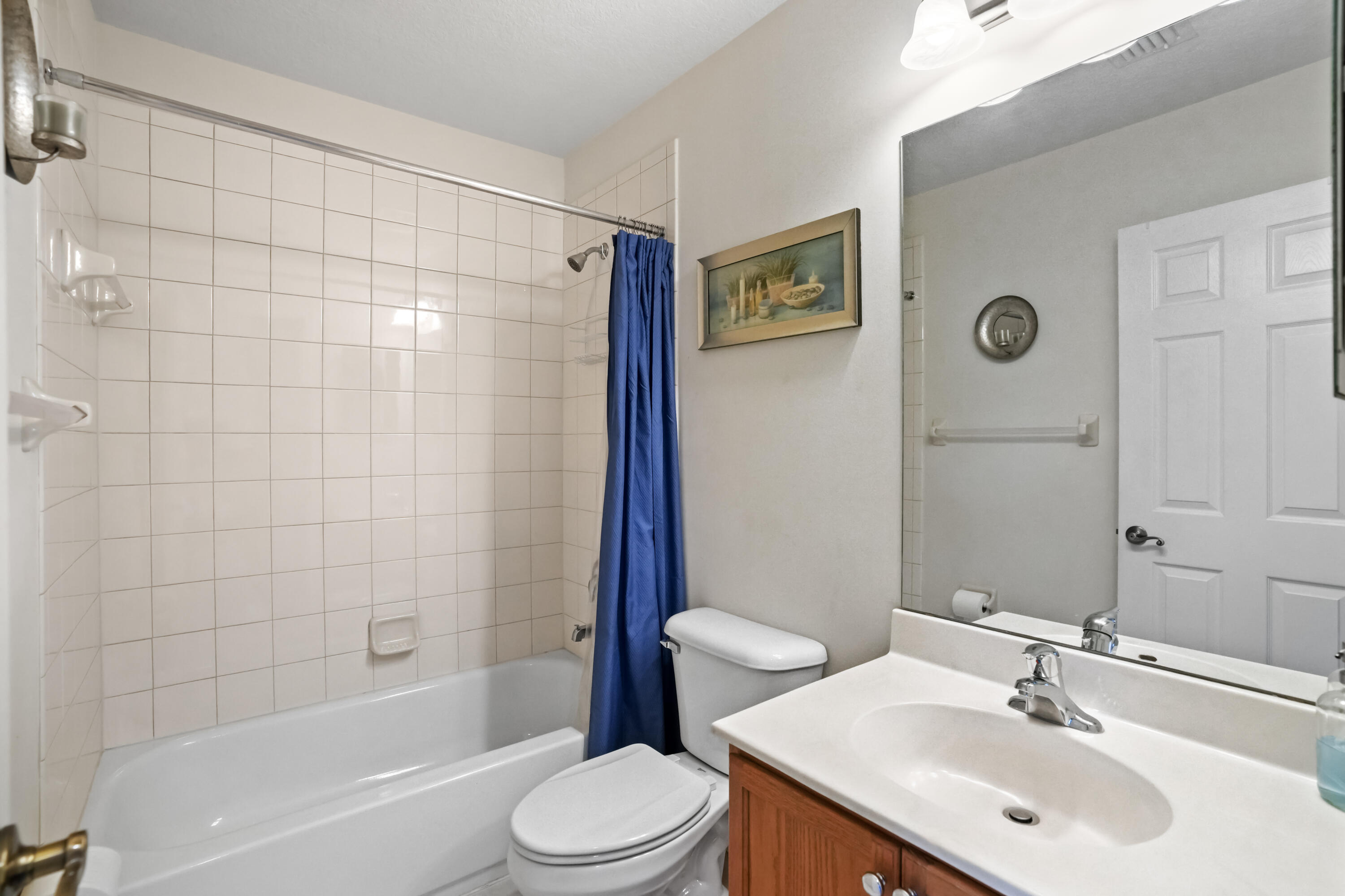 5961 London Lane Tamarac, FL 33321 - Photo 13 of 21 a bathroom with a sink a toilet and shower