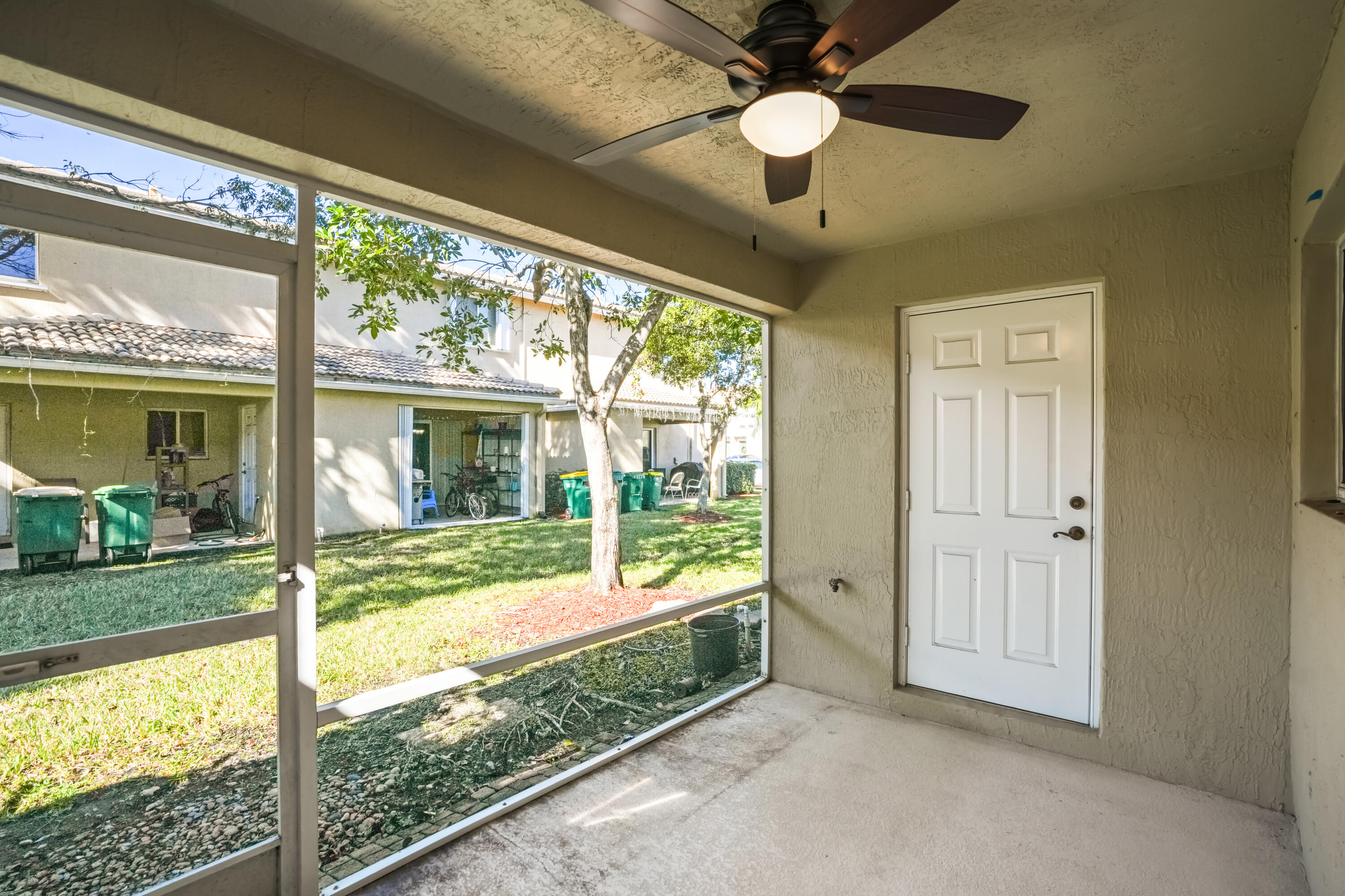 5961 London Lane Tamarac, FL 33321 - Photo 18 of 21 a view of an entryway with a ceiling fan