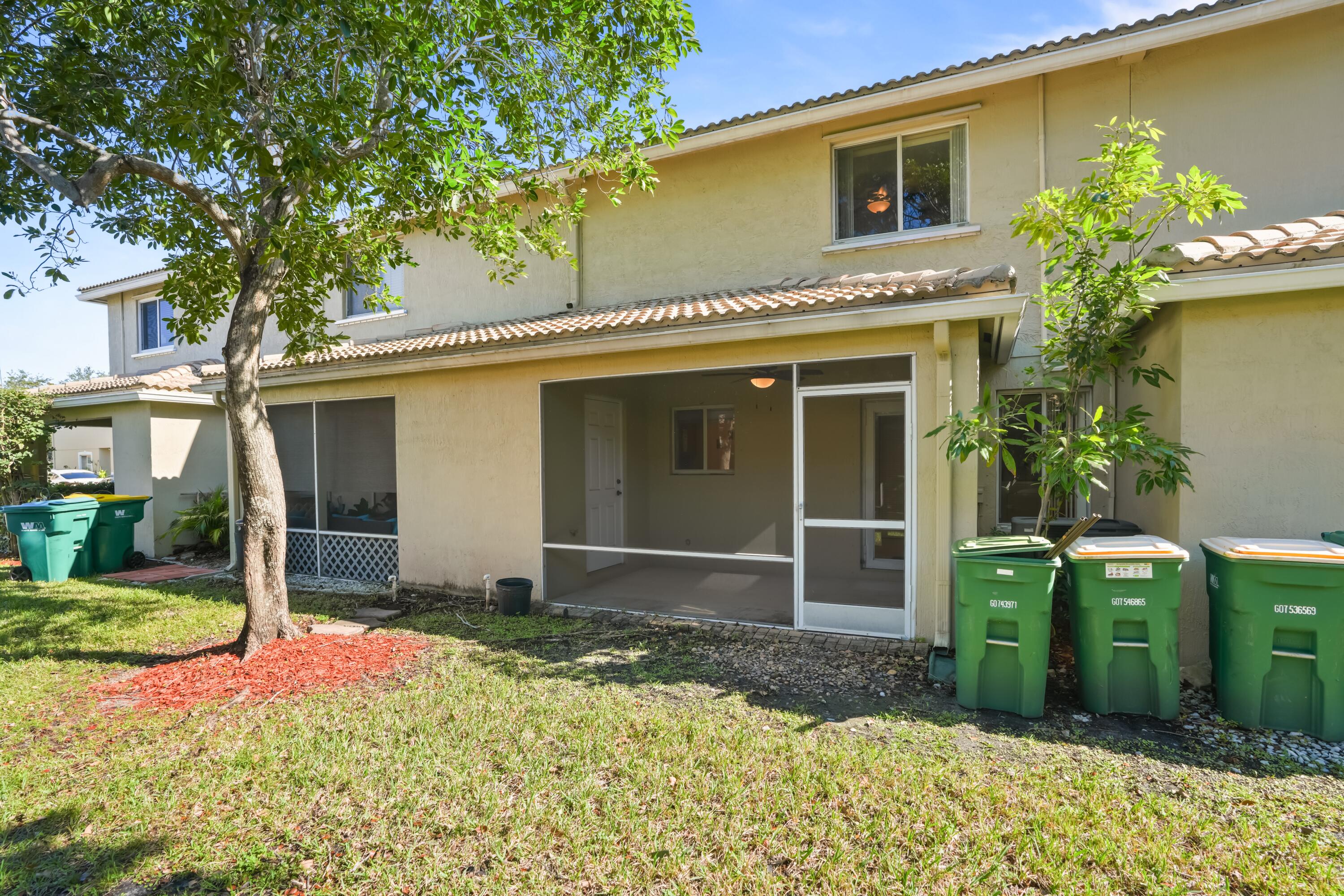 5961 London Lane Tamarac, FL 33321 - Photo 19 of 21 front view of a house with a yard