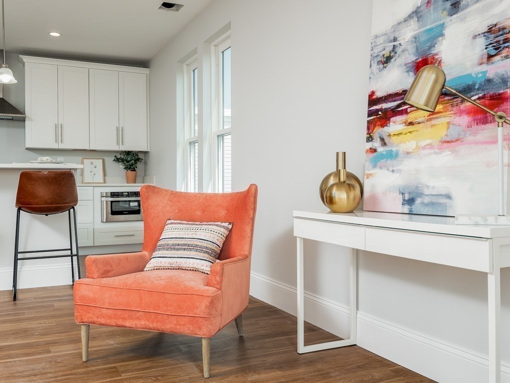 45 L Street, Unit 20 Boston, MA 02127 - Photo 13 of 28 a living room with furniture and wooden floor